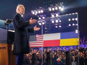 US President Joe Biden gestures at the audience after speaking at the Royal Warsaw Castle Gardens in Warsaw on February 21, 2023. (Photo by MANDEL NGAN/AFP via Getty Images)