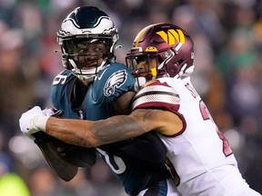 Quez Watkins of the Philadelphia Eagles fumbles the ball against Benjamin St-Juste of the Washington Commanders during the fourth quarter in the game at Lincoln Financial Field on November 14, 2022 in Philadelphia, Pennsylvania.