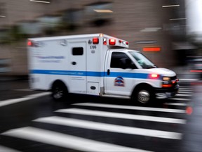 An ambulance arrives at the emergency entrance outside Mount Sinai Hospital in Manhattan in New York City, April 13, 2020.