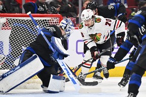 Chicago Blackhawks forward Cole Guttman (70) attempts to skate the puck in on Toronto Maple Leafs goaltender Ilya Samsonov (35) in the first period at United Center Feb 19, 2023. Jamie Sabau-USA TODAY Sports