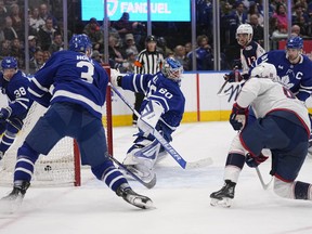Blue Jackets forward Kirill Marchenko scores on Maple Leafs goaltender Joseph Woll (60) during the second period at Scotiabank Arena on Saturday night.