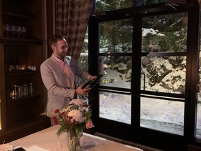 Resort sommelier Nick Humphreys sabers off some Okanagan sparkling wine at the Fairmont Chateau Whistler. Jane Stevenson/Toronto Sun