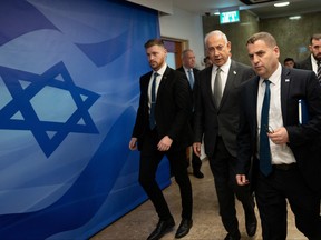 Israeli Prime Minister Benjamin Netanyahu arrives for  the weekly cabinet meeting in Jerusalem, Sunday, Feb. 12, 2023.