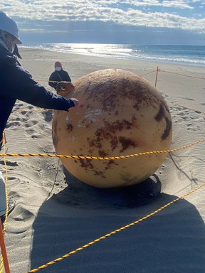 A ball is seen on a beach in Hamamatsu, Japan, Feb. 22, 2023, in this still image obtained from Twitter.