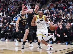 Utah Jazz guard Talen Horton-Tucker heads to the basket against Toronto Raptors centre Jakob Poeltl during the fourth quarter at Scotiabank Arena on Friday night.