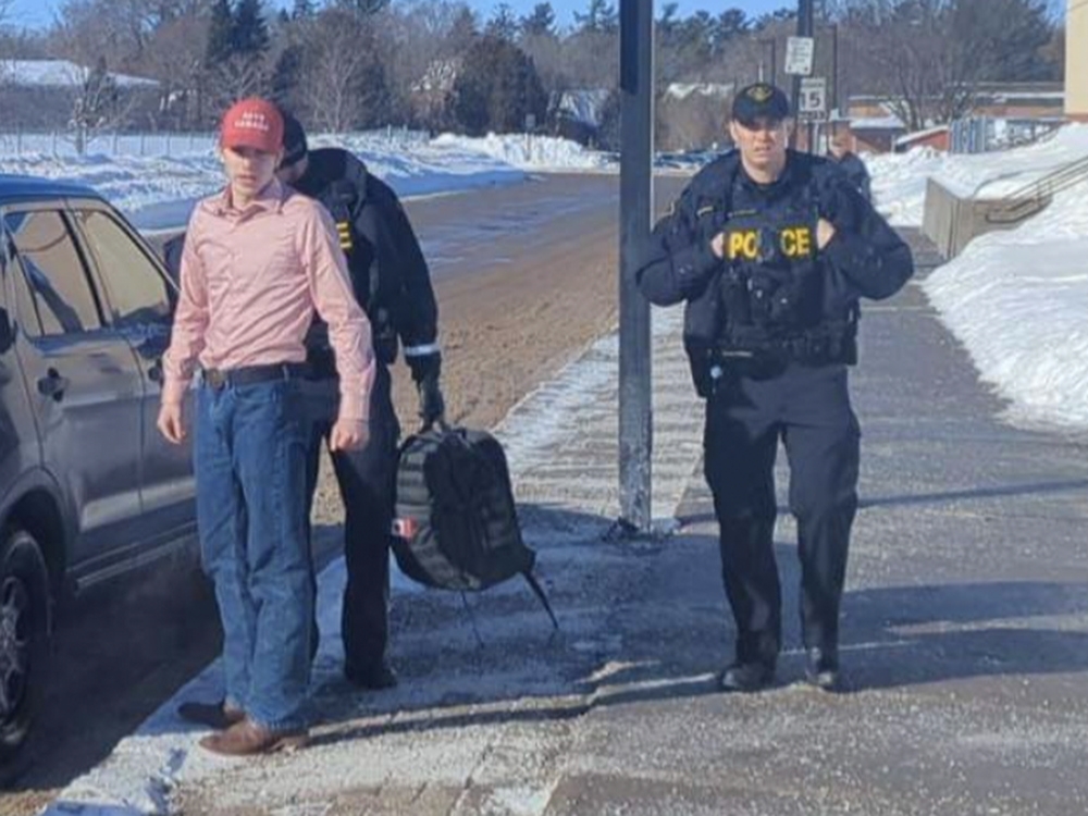 SUSPENDED AND ARRESTED High school student asserts there are only "two