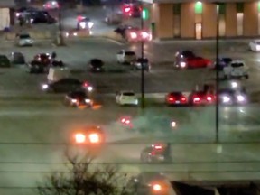 Screenshot from a video posted to twitter shows several cars spinning around and making noise at night reportedly at Westwood Square parking lot in Malton.