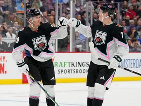 Atlantic Division forward Matthew Tkachuk (19) of the Florida Panthers fist bumps Atlantic Division forward Brady Tkachuk (71) of the Ottawa Senators during the second period of a semifinal game during the 2023 NHL All-Star Game at FLA Live Arena in Sunrise, Fla., Saturday, Feb. 4, 2023.