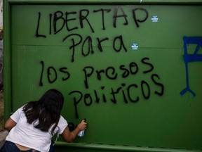In this file photo taken Feb. 3, 2020, university students in Managua protest demanding Nicaraguan President Daniel Ortega's government release political prisoners.