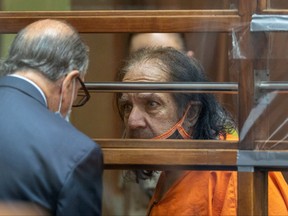 Adult film star Ron Jeremy, whose real name is Ronald Jeremy Hyatt in talks with his attorney Stuart Goldfarb during an arraignment hearing at Clara Shortridge Foltz Criminal Justice Center in Los Angeles, Calif., June 26, 2020.
