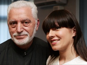 In this file photo taken on June 11, 2007, Spanish-born fashion designer Paco Rabanne (left) poses with Ukrainian designer Veronika Jeanvie after their press conference in Kyiv.