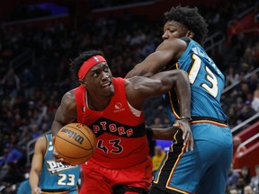 Raptors forward Pascal Siakam (left) is defended by Pistons centre James Wiseman (right) during first half NBA action at Little Caesars Arena in Detroit, Saturday, Feb. 25, 2023.