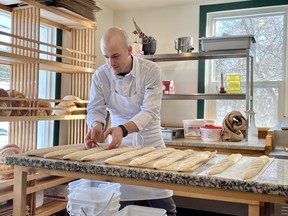Roberto Catervi of Roberto Pizzeria Romano, preps the daily baguette production at his restaurant in Chelsea, Que.