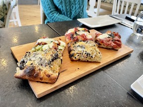 J’AIME LE QUEBEC: Fall in love with the food, snow pursuits and lodgings A selection of pizza offered at Roberto Pizza Romano in Chelsea, Que. (EDDIE CHAU/Toronto Sun)