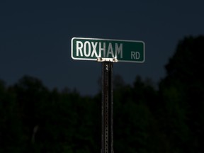 PERRY MILLS, NEW YORK -  The Roxham Road sign early in the morning near Perry Mills, New York, June 3, 2018. Thousands of asylum seekers have illegally crossed the border at Roxham Road in New York into Quebec this year.  (Tyler Anderson / National Post)