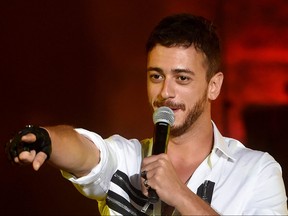 In this file photo taken July 30, 2016, Morocco singer Saad Lamjarred performs during the 52nd session of the International Carthage Festival at the Roman Theatre of Carthage near Tunis.