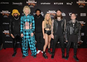From left to right: Justin Lyons, Machine Gun Kelly, SlimmXX, Sophie Lloyd, Steve “Baze” Basil and ROOK attend the 2023 Sports Illustrated Super Bowl Party at Talking Stick Resort on Feb. 11, 2023 in Scottsdale, Ariz.