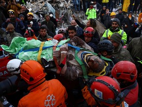 Rescuers from Turkey and United Hatzalah carry a 56-year-old survivor, Ali Korkmaz, in the aftermath of a deadly earthquake, in Kahramanmaras, Turkey, February 10, 2023.