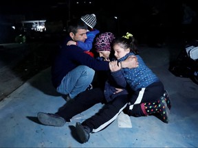 People react after an earthquake in Antakya in Hatay province, Turkey, Feb. 20, 2023.