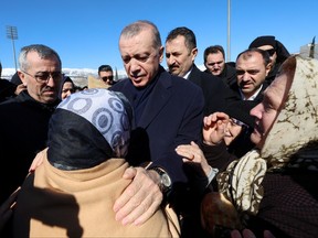 Turkish President Tayyip Erdogan meets with people in the aftermath of a deadly earthquake in Kahramanmaras, Turkey, Feb. 8, 2023.
