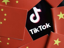 China's flags are seen near a TikTok logo in this illustration picture taken July 16, 2020.