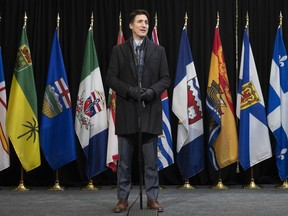 Prime Minister Justin Trudeau speaks with media as he arrives for a health care meeting with premiers, Tuesday, February 7, 2023 in Ottawa.  THE CANADIAN PRESS/Adrian Wyld