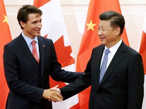 FILE PHOTO: Chinese President Xi Jinping (R) shakes hands with Canadian Prime Minister Justin Trudeau ahead of their meeting at the Diaoyutai State Guesthouse in Beijing, China August 31, 2016. REUTERS/Wu Hong/Pool//File Photo