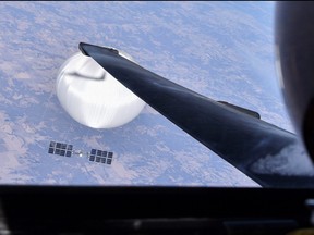 A U.S. Air Force U-2 pilot looks down at the suspected Chinese surveillance balloon as it hovers over the central continental United States on Feb. 3, 2023 before later being shot down by the Air Force off the coast of South Carolina, in this photo released by the U.S. Air Force through the Defense Department on Feb. 22, 2023.