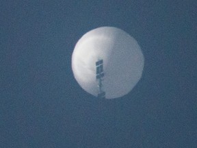 A balloon flies in the sky over Billings, Montana, Feb. 1, 2023 in this picture obtained from social media.