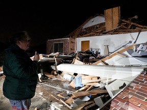 Barbara Buckner looks over her home that was destroyed by a tornado in Norman, Oklahoma, February 27, 2023.