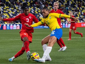 Canadas Kadeisha Buchanan (L) fights for the ball against Brazils Bia Zaneratto during the 2023 SheBelieves Cup women's soccer match between Canada and Brazil at Geodis Park in Nashville, Tennessee, on February 19, 2023.