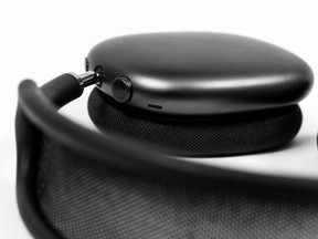 Close up view of one side of new space gray Apple AirPods Max.