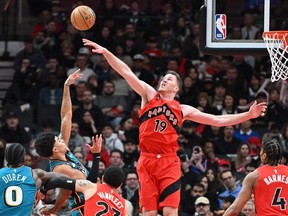 Toronto Raptors center Jakob Poeltl blocks a shot from Detroit Pistons guard Killian Hayes in the first half at Scotiabank Arena.