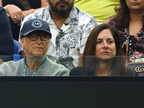 Bill Gates is pictured with Paula Hurd in the stands ahead of the final match between Serbia's Novak Djokovic and Greece's Stefanos Tsitsipas at the Australian Open men's singles finals in Melbourne, Australia, Jan. 29, 2023.