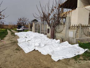 This photo obtained from Italian news agency Ansa, taken on February 26, 2023 shows bags containing the bodies of deceased migrants in Steccato di Cutro, south of Crotone, after their boat sank off Italy's southern Calabria region.