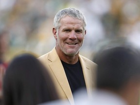 In this Oct. 16, 2016, file photo, Hall of Fame quarterback Brett Favre is shown during a halftime ceremony of an NFL football game against the Dallas Cowboys, in Green Bay, Wis.