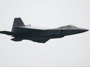 A United States Air Force F-22 Raptor fighter jet performs an aerial display during the Singapore Airshow media preview on Feb. 9, 2020 in Singapore.