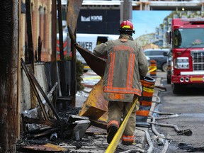 Toronto Fire Service with Toronto Police are investigating a suspicious two-alarm fire that has destroyed Myth restaurant on Brant St. north of King St. W. Toronto Fire Investigator Isaac Cumbo walks past the front patio area which was severely damaged by the fire on Tuesday, Feb. 28, 2023.