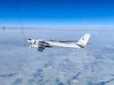 In this handout photo taken from video released by Russian Defense Ministry Press Service on Tuesday, Feb. 14, 2023, A Tu-95 strategic bomber of the Russian air force is seen from another one during their mission. Two Russian Tu-95 strategic bombers flew a patrol mission over the Bering Sea.