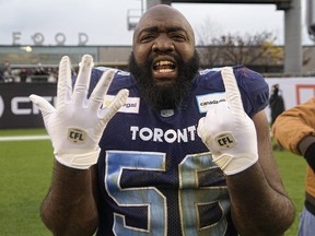 Toronto Argonauts defensive lineman Ja'Gared Davis shows that he has won 6 consecutive division titles in his career after a win over the Montreal Alouettes at BMO Field.