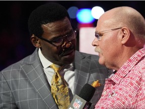 Kansas City Chiefs head coach Andy Reid speaks with NFL Network reporter Michael Irvin during Super Bowl Opening Night at Footprint Center.