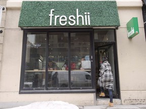 A customer walks into a Freshii restaurant in Montreal on March 21, 2017.