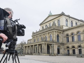 A TV cameraman films the State Opera in Hanover, Germany, Monday, Feb. 13, 2023.
