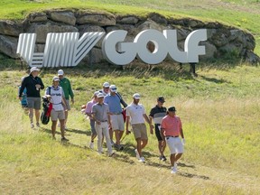 Sep 1, 2022; Boston, Massachusetts, USA; Pat Perez and Dustin Johnson walk down to the green during the Pro-Am round of the LIV Golf tournament at The International.