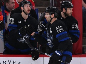 Toronto Maple Leafs forward John Tavares  celebrates with the bench after scoring a power play goal in the first period against the Chicago Blackhawks  at United Center.