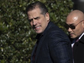 JUST SAY SLEAZE! Hunter Biden walks along the South Lawn before the pardoning ceremony for the national Thanksgiving turkeys at the White House in Washington, Nov. 21, 2022.