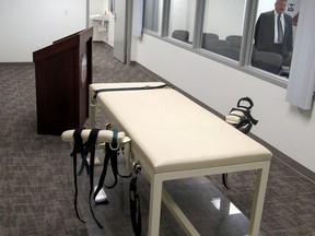 In this Oct. 20, 2011 file photo, the execution chamber at the Idaho Maximum Security Institution is shown as Security Institution Warden Randy Blades look on in Boise, Idaho.