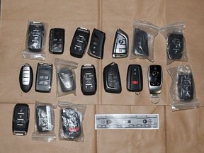 Officers interrupted a suspected auto theft and arrested two people -- seizing tools, key fobs, programming equipment consistent with stealing motor vehicles, a handgun, ammunition, fentanyl, cocaine, and crack cocaine -- in Etobicoke on Tuesday, Feb. 21, 2023.