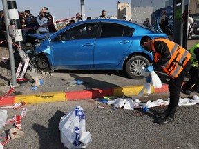 Israeli emergency responders gather at the site of a reported ramming attack in Jerusalem on February 10, 2023.