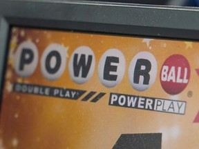 A display panel advertises tickets for a Powerball drawing at a convenience store, Nov. 7, 2022, in Renfrew, Pa.